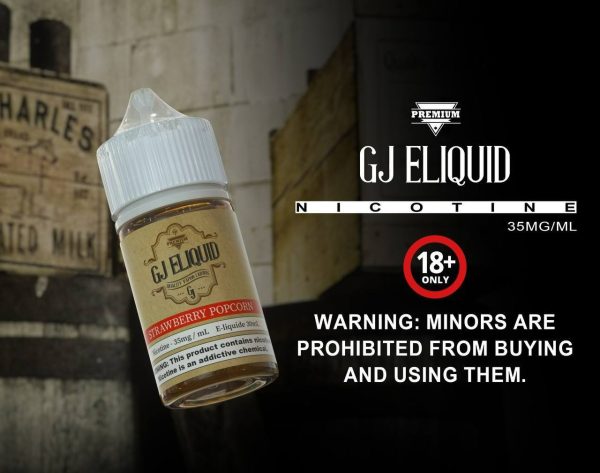 GJ 煙油草莓爆米花口味產品照，背景為老街牆面，營造復古甜點風情。